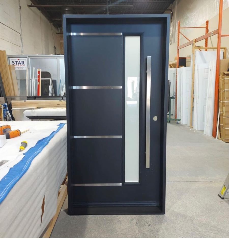 Black front door with metal accent bars and a tall frosted glass strip